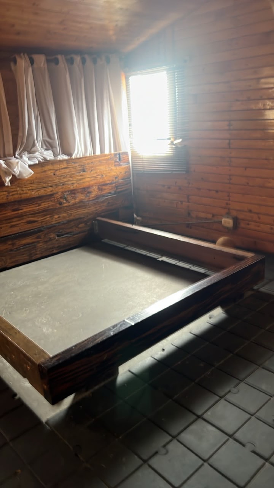 Hand-built hardwood bed frames for the lofts